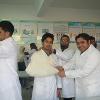 Explaining how to use a triangular bandage